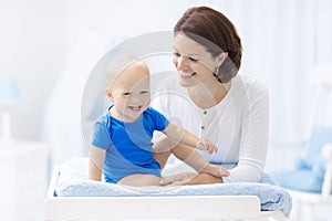 Mother and baby on changing table