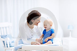 Mother and baby on changing table