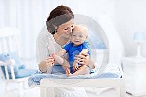 Mother and baby on changing table