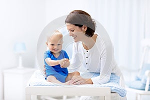 Mother and baby on changing table