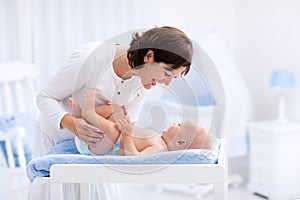 Mother and baby on changing table