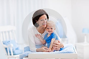 Mother and baby on changing table