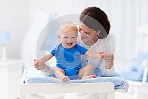 Mother and baby on changing table