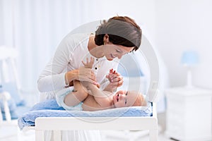 Mother and baby on changing table