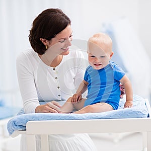 Mother and baby on changing table