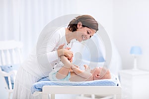 Mother and baby on changing table