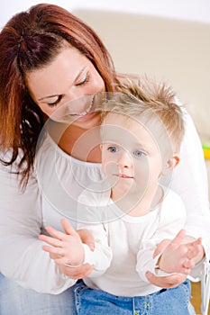 Mother and baby clapping