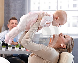 Mother and baby daughter having fun