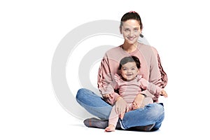 Mother and baby daughter isolated on white.