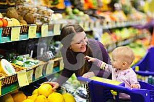 Mother and baby daughter in supermarket