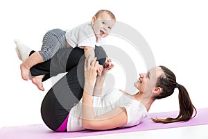 Mother with baby do gymnastics and fitness exercises