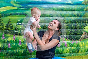 Mother with baby doing gymnastics