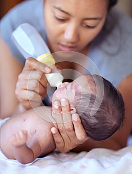 Mother, baby and feeding milk from bottle for nutrition, health and wellness. Formula, newborn and mom feed child for