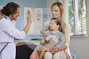 Mother with baby girl at doctor's office