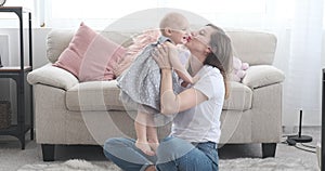 Mother with baby girl learning to walk