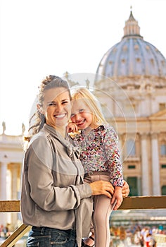 Mother and baby girl on piazza san pietro