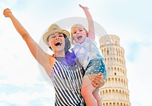 Mother and baby girl rejoicing in pisa