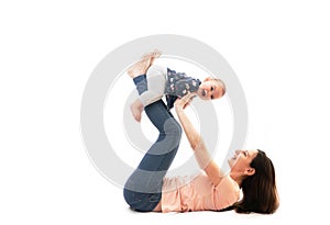 A mother and baby gymnastics, yoga exercises isolated on white background fitness