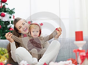 Mother and baby having fun time on Christmas