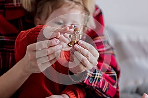 Mother and baby holding gingerman cookie