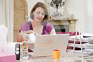 Mother and baby in home office