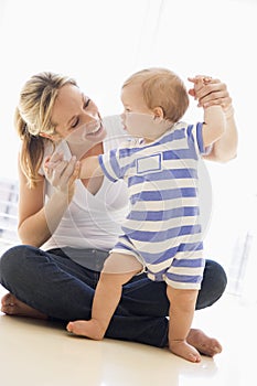 Mother and baby indoors playing