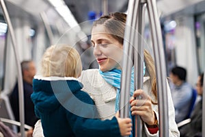 Mother with baby inside metro train