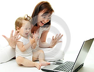 Mother and baby with laptop