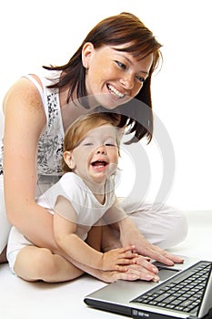 Mother and baby with laptop