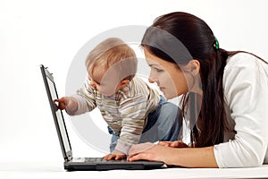 Mother and baby with laptop photo