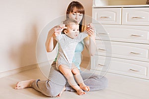 Mother and baby legs. First steps.