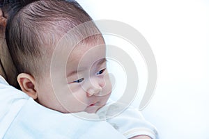 Mother and baby, Lovely asian girl resting on her mother's shoul