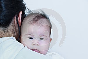 Mother and baby, Lovely asian girl resting on her mother`s shoul