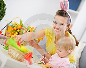 Mother and baby making easter decoration