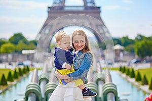 Mother and baby near the Eiffel tower