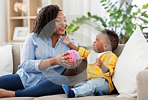 Mother and baby playing with ball at home