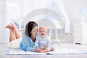 Mother and baby playing on the floor