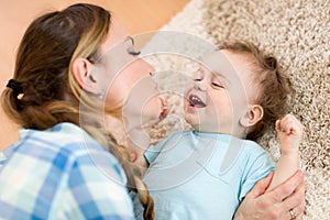 Mother with baby playing together at home