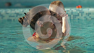 Mother and baby in the pool