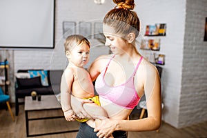 Mother and baby portrait at home