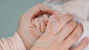 Mother and baby`s hands.