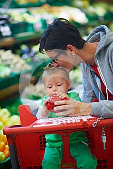 Mother with baby in shopping