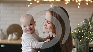 Mother and Baby slow motion. Happy Family. Mom With her Child smiling and laughing at home.
