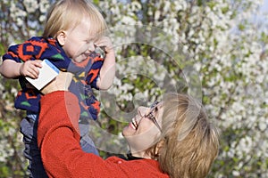 Mother and baby in spring garden