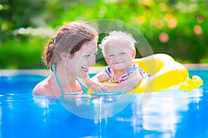 Mother and baby in swiming pool