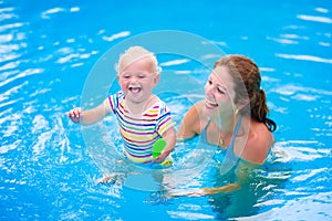 Mother and baby in swiming pool