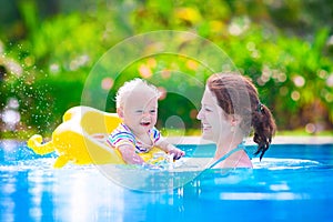 Mother and baby in swiming pool