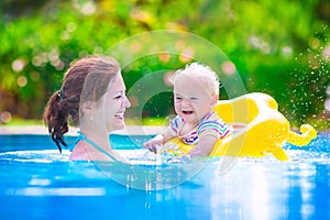 Mother and baby in swiming pool