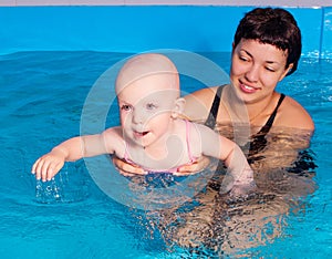 Mother and baby swimming