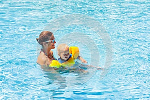 Mother and baby in swimming pool